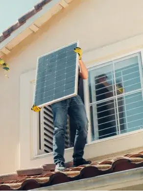 Solar electrician installing solar power panel
